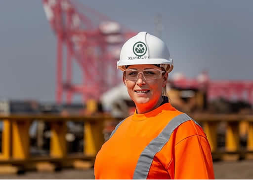 Person wearing hard hat at an EMR recycling site