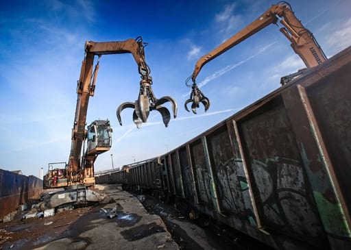 Cranes working in scrap metal yard